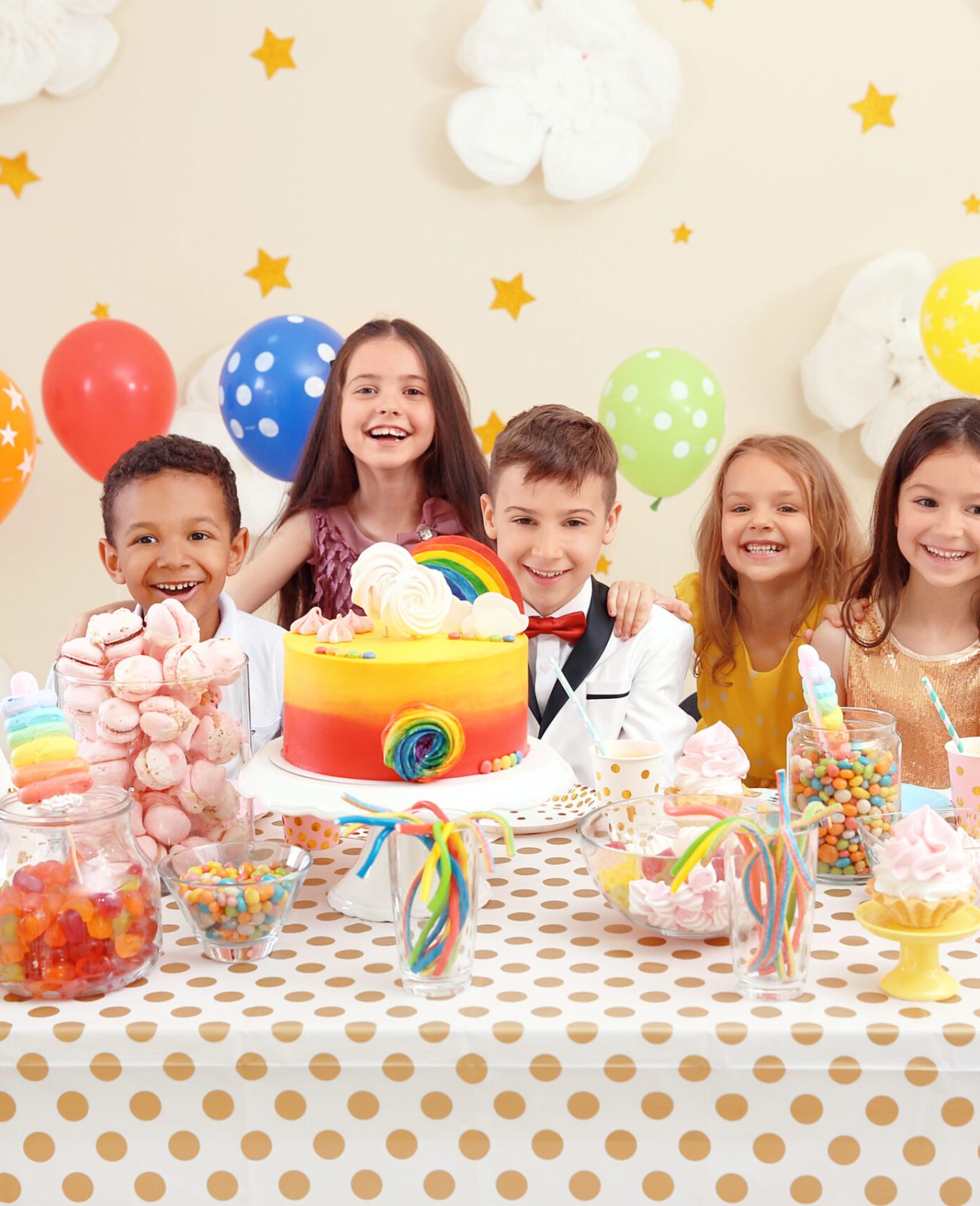 Cute children celebrating birthday at table indoors